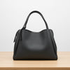 Black handbag on a white background