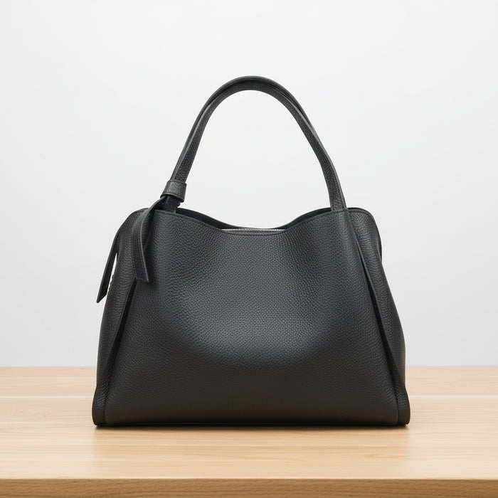 Black handbag on a white background
